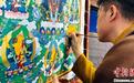 “非遗”传承人国赛现场绘画唐卡展示民族文化