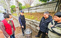 硚口区两个街道提供铁桶作香炉,破解市民当街焚烧钱纸污路损绿难题