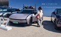 开着中国电车,横穿欧亚:这对情侣把“3平方米的中国展台”开到了德国