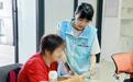 金融安全进社区,非遗添香护银龄:人保健康深圳分公司开展“4·15”国家安全日主题宣传活动