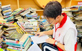 南昌社区40名学生志愿者给五千册图书安了个“明白家”