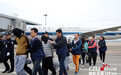 14名特大跨国电信诈骗案嫌犯被押解回广州