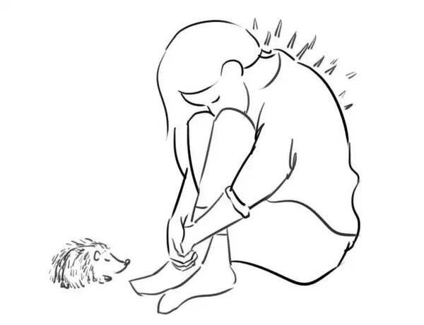 一个人蜷缩在角落图片