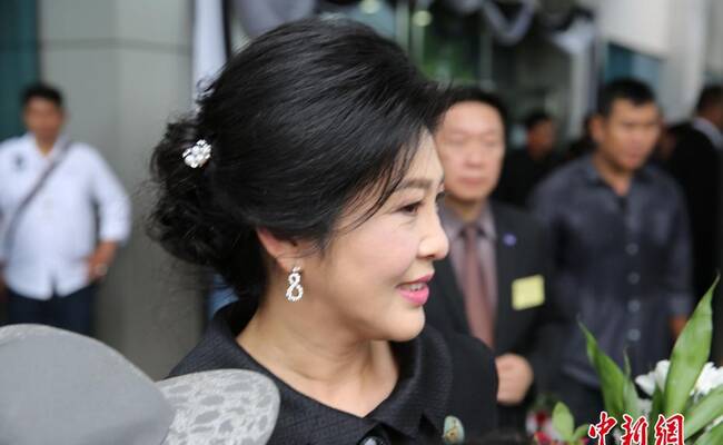 英拉出席大米收购案最后庭审