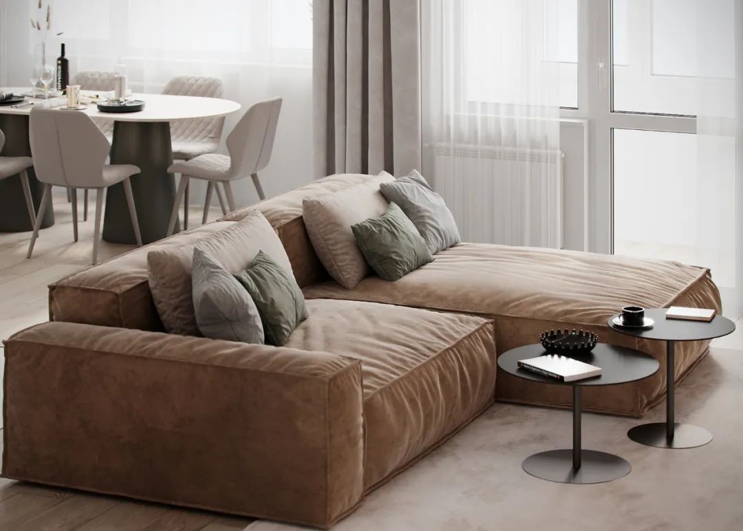 客厅 棕色的沙发添加米白色地毯过渡调配,最后与白色的电视背景墙