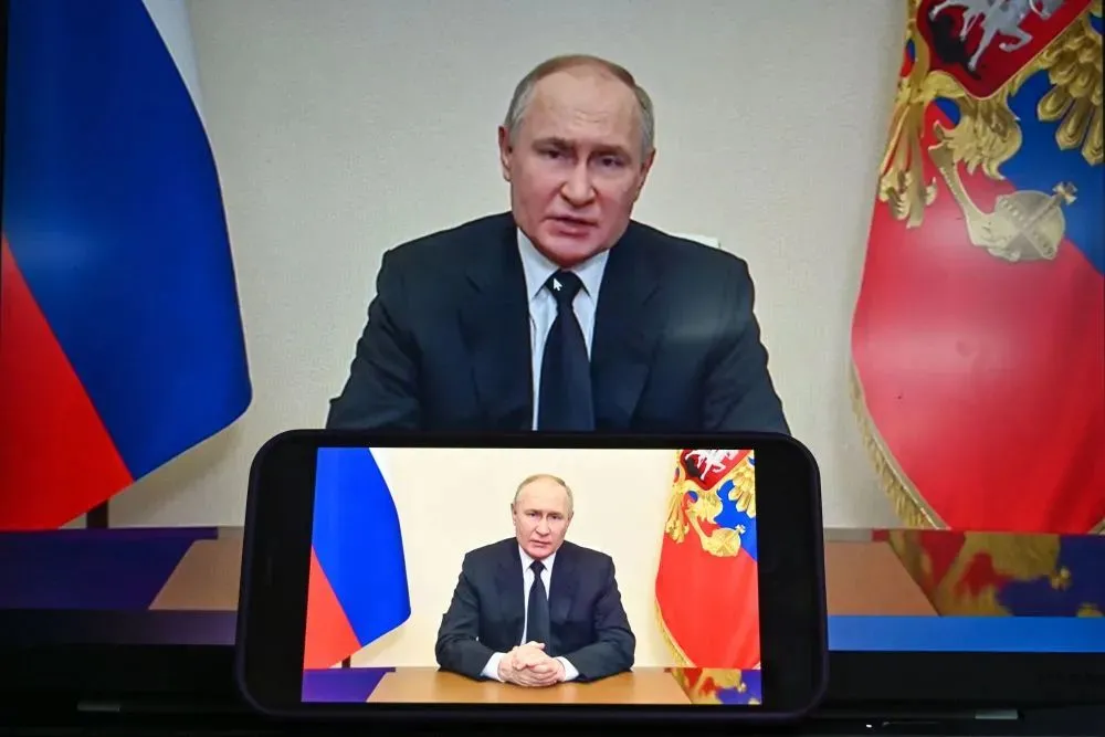 这是3月23日在俄罗斯首都莫斯科拍摄的俄罗斯总统普京发表讲话的视频画面。新华社记者 曹阳 摄