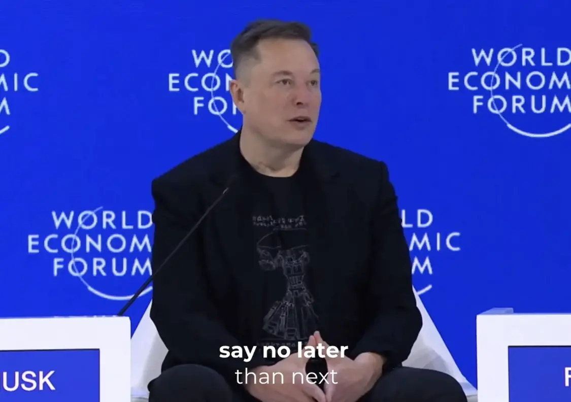 马斯克22日在达沃斯预测AI发展。图源:视频截图