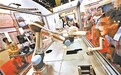 消杀机器人、咽拭子采样机器人、化验机器人等多款智能产品在服贸会上引人驻足