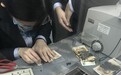 女子担心沾染病毒将51张人民币放微波炉加热