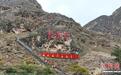 四川凉山“悬崖村”蝶变文旅地标 村民吃上“旅游饭”
