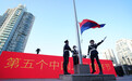 在第五个中国人民警察节，国旗警旗飞越上海黄浦江