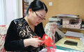 非遗传承人纸上生花 “剪”造巾帼“梦工厂”