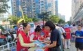 劳动社区开展“路口讲‘盔’法，街头说安全”交通安全宣传活动