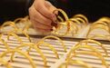金价高位波动，金条、金币热销